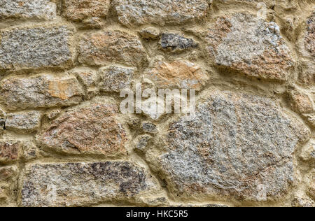 Natural yellow pavement stone texture for floor, wall or path. Traditional fence, court, backyard or road paving. Stock Photo