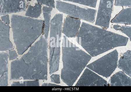 Natural paving stone slabs floor, walkway or sidewalk texture. Traditional fence, court, backyard or road paving. Stock Photo