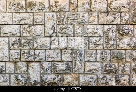 Natural gray pavement stone for floor, wall or path texture. Traditional fence, court, backyard or road paving. Rough stone texture background. Stock Photo