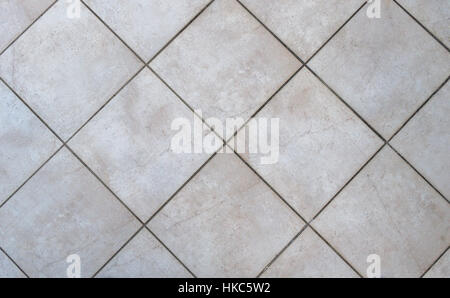 Interior bathroom tiles tiles. Image of interior flooring with grey beige pavement slabs. Stock Photo