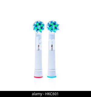 Electric Toothbrush replacement heads with color rings, isolated on white background. Stock Photo