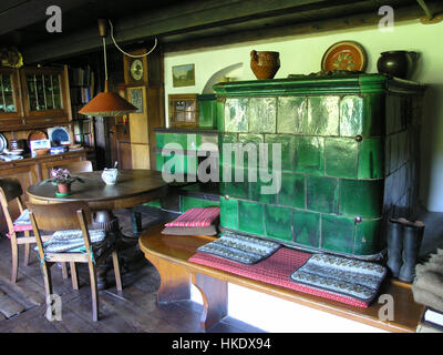 Parlor with tiled stove in historic blackforest farmhouse Blackforest, Germany Stock Photo