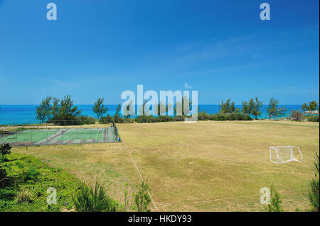 Sport field next to sea in Bermuda island Stock Photo