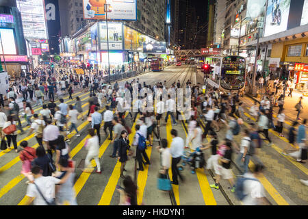 HONG KONG, HONG KONG - SEPTEMBER 23 2015: Pedestrians rush through a very busy intersection in the shopping district of Causeway Bay in Hong Kong isla Stock Photo