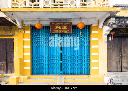 HOI AN, VIETNAM - FEBRUARY 7, 2016: A colorful facade in Hoi An old town. The city in central Vietnam was an important trade center even before the fr Stock Photo