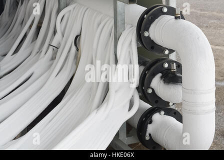 Part of industrial refrigeration system with pipes and valve Stock Photo