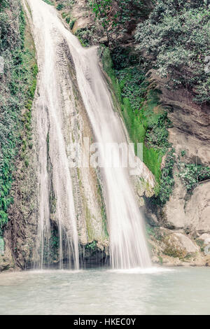 waterfall among the rocks in the forest. beautiful nature background in ...