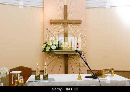 The altar with tabernacle and the cross in the Adoration chapel. Stock Photo