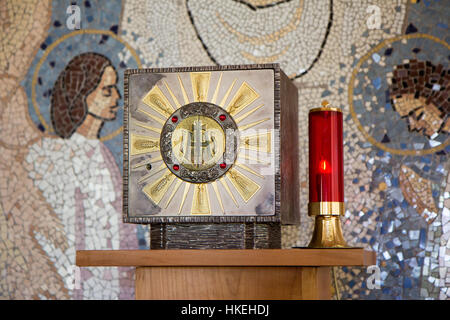 A tabernacle with the Eucharist and a sanctuary candle lamp in a chapel in Majčino selo [Mother's village] in Medjugorje, Bosnia and Herzegovina. Stock Photo