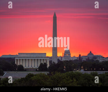 The glow of a rising sun behind the Capitol Stock Photo