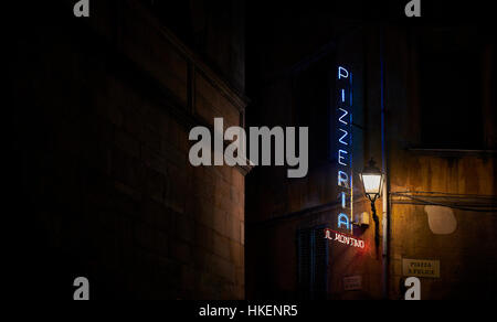 Pisa, Italy - July 27, 2016. Pizzeria neon in a european street at night. Stock Photo