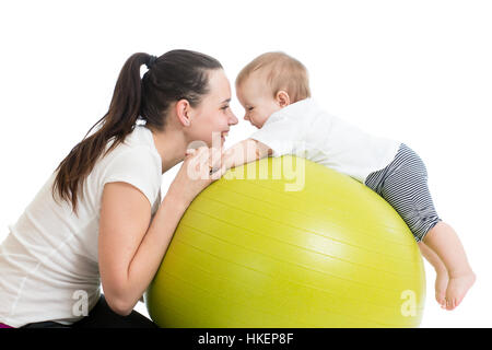 mother with baby doing gymnastics and having fun Stock Photo