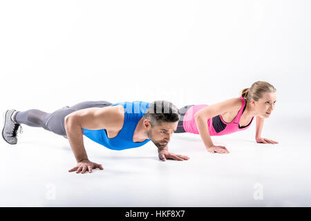 Couple doing push ups Stock Photo