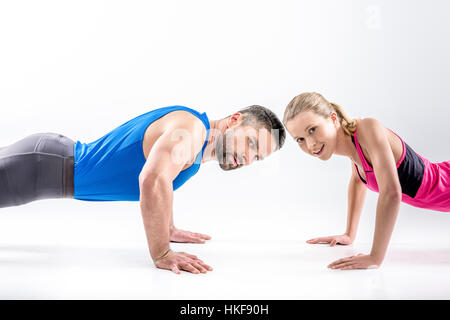 Couple doing push ups Stock Photo