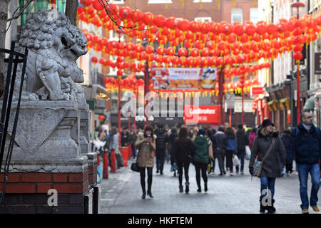 Lanterns are strung across Gerrard Street in Chinatown, London, as preparations are made ahead of the Chinese New Year celebrations at the weekend. Stock Photo