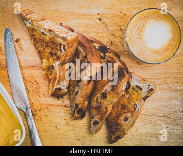Fruit toast on chopping board with coffee Flat lay Stock Photo