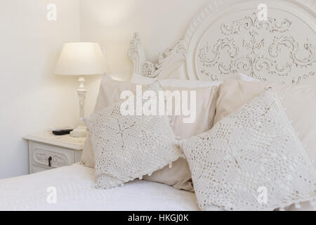 Detail of a bed and nightstand Stock Photo