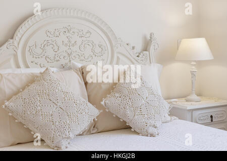 Detail of a bed and nightstand Stock Photo