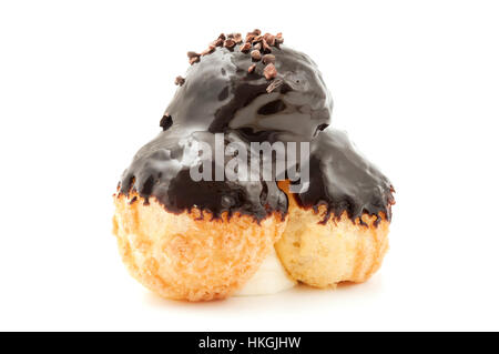 Profiterole with chocolate ganache on a white background Stock Photo