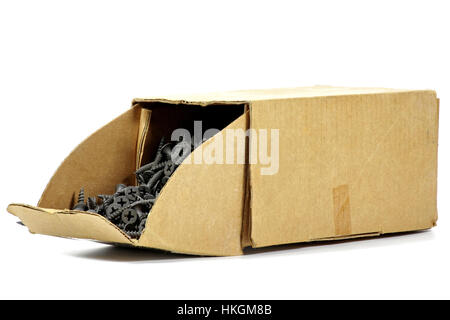 phosphated drywall screws in a cardboard container isolated on white background Stock Photo