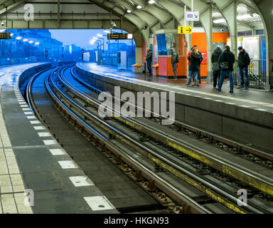 BERLIN, GERMANY - DECEMBER 1 2016: The busy U-Bahn station at dusk with waiting passengers at Alexanderplatz, Berlin Stock Photo