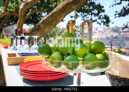 Bowl of Limes on a Outdoor Bar Stock Photo