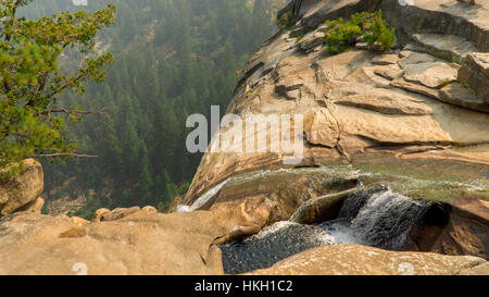 A beautiful view of a waterfall from a cliff Stock Photo