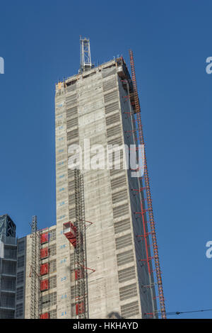 Office construction (central lift shaft / core / tower) in City of London near Bank. Showing external works / materials lift. Under construction. Stock Photo