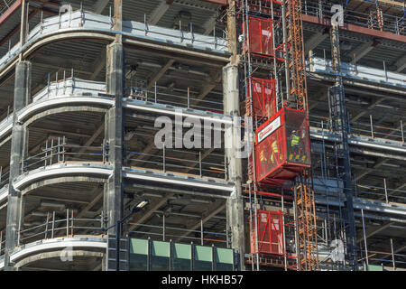 Office construction in the City of London near Bank. Showing external works lift reaching unfinished levels. For UK construction sector. Stock Photo
