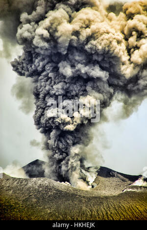A view of the caldara of Mt. Tavurvur volcano when it is erupting. This is near the town of Rabaul, Papua New Guinea. Stock Photo