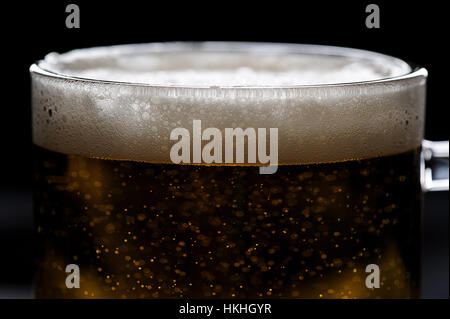close up of bubbles on beer foam in glass Stock Photo