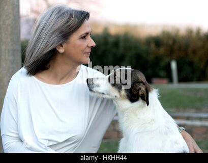 Adult Woman with dog, outdoors. Stock Photo