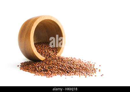 Red quinoa seeds in wooden bowl. Stock Photo