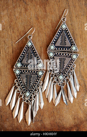 Beautiful Aztec earrings on wooden background Stock Photo - Alamy