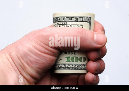 100 dollars bill on hand on white background Stock Photo