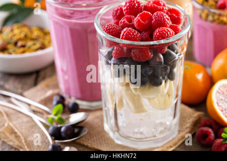 Berry smoothie ingredients in tall glass