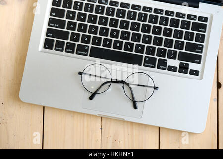 Wooden desk with various gadgets and accessories Stock Photo