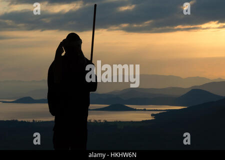 Man with a walking stick at Abaya Lake, Arbaminch, Ethiopia Stock Photo