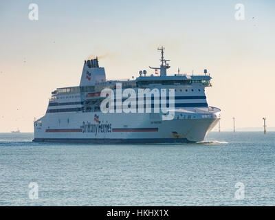 A Brittany ferries car ferry, Cap Finistère, enters Portsmouth Harbour from the Solent, Hampshire England Stock Photo