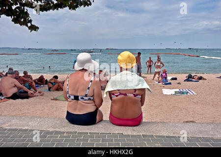 Amusing image reminiscent of the 1950s UK postcards with two mature ladies at the seaside. Stock Photo