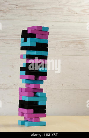 jenga colour tower tall on wood table Stock Photo