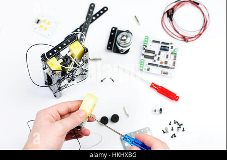 assemble robot toy isolated on white background Stock Photo