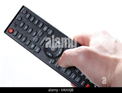 modern tv remote in hand isolated on white background Stock Photo