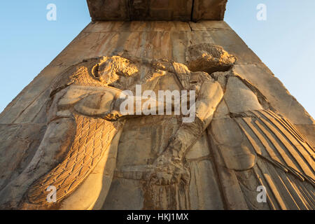 Bas-relief of the king fighting a lion on a gate of the Palace of Darius I (Tachara), Persepolis; Fars Province, Iran Stock Photo