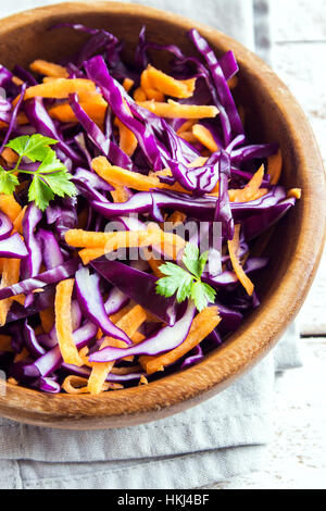 Red Cabbage Coleslaw Salad with Carrots and Greens - healthy diet, detox, vegan, vegetarian, vegetable spring salad Stock Photo