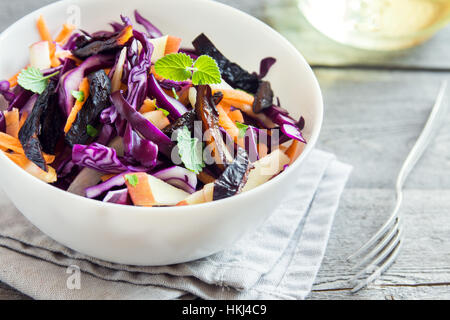 Red Cabbage Coleslaw Salad with Carrots, Apples and Prunes - healthy diet, detox, vegan, vegetarian, vegetable spring salad Stock Photo