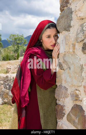 Mary Magdalene standing at the entrance of the empty tomb of Jesus on ...