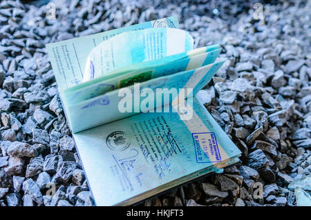 Lost passport on a stoney path open at a page with a Canadian Visa Stock Photo