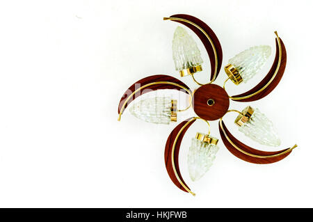 Light bulb fitting from the 1970s with wood, brass and glass, against a white ceiling Stock Photo