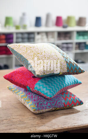 Three cushions on table, Bavaria, Germany Stock Photo
